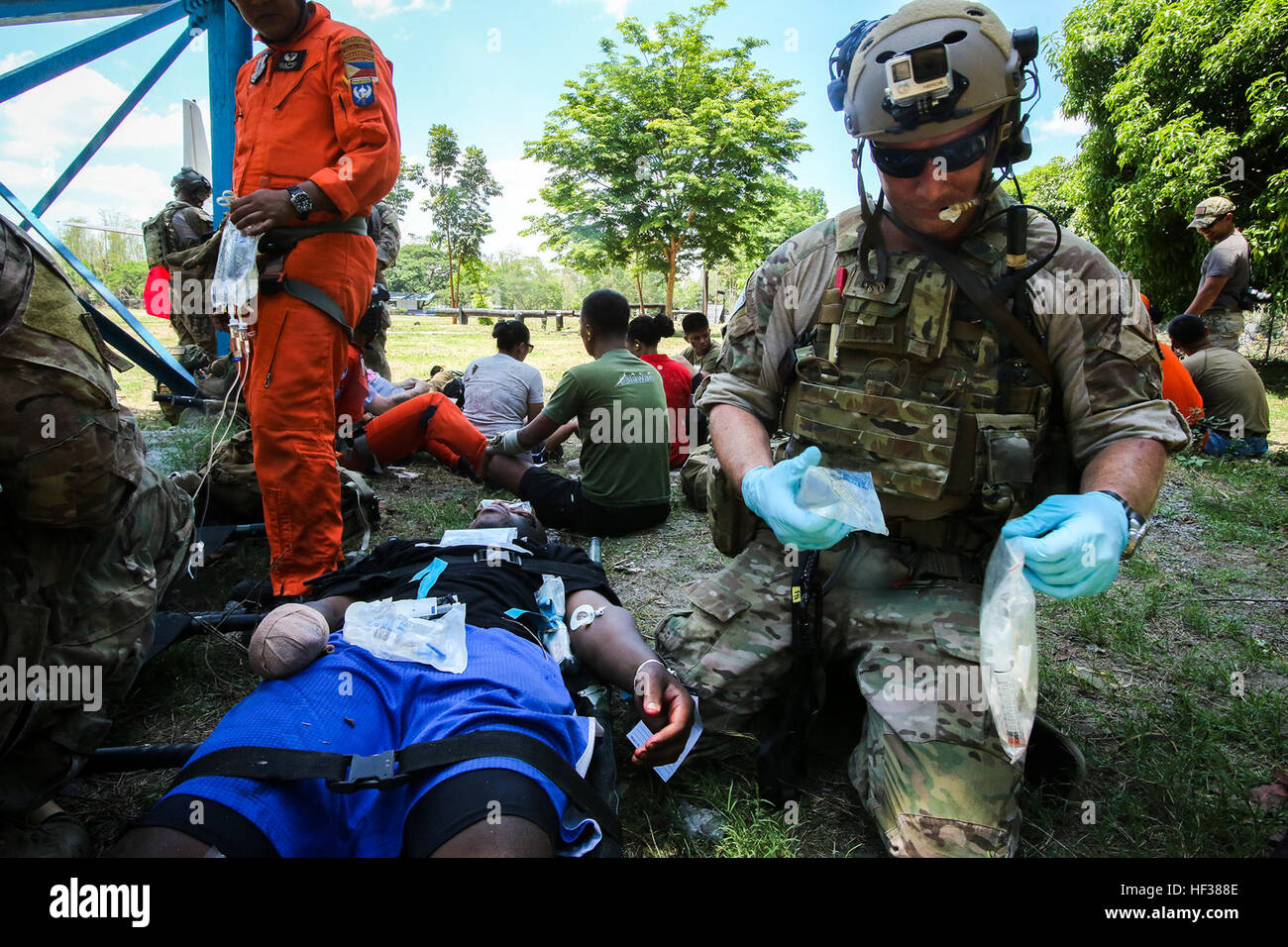 U.S. Air Force Staff Sgt. Jason Fischman, a pararescueman with 31st Rescue Squadron, assists victims of a plane crash as part of a notional mass casualty incident during Exercise Balikatan 2015, in Clark Air Base, Philippines, April 24. The drill was conducted alongside rescuemen from the 505th Rescue and Search Group of the Philippine Air Force. The bilateral training event provided both rescue teams with a better understanding of how each other operates and ensures mission accomplishment should they work side-by-side in the future. Balikatan is an annual Philippines-U.S. military training ex Stock Photo