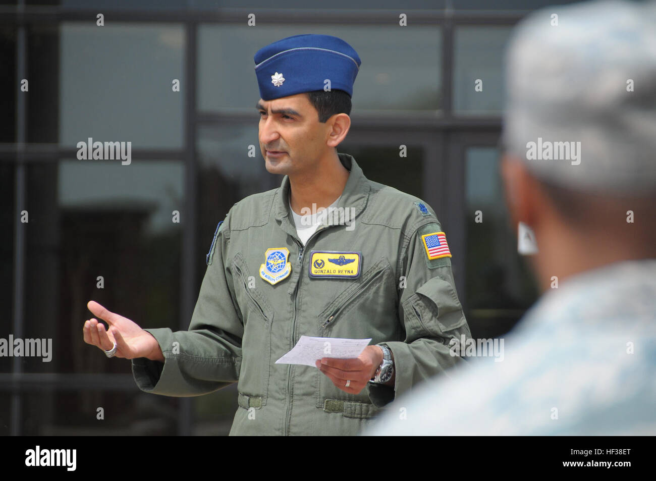 Lt. Col. Gonzalo Reyna, commander of the 906th Air Refueling Squadron, speaks at an outdoor memorial service for Capt. Brandon Cyr on the second anniversary of his death, April 27, 2015. The 906th Air Refueling Squadron held a memorial service for Capt. Brandon Cyr who died in a plane crash in Afghanistan. (Air National Guard photo by Master Sgt. Ken Stephens) Memorial Walk in honor of Capt. Brandon Cyr 150427-Z-TL822-002 Stock Photo