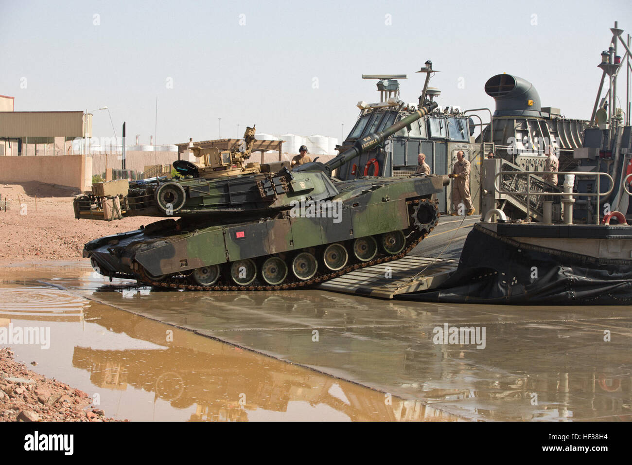 A U.S. Marine Corps M1A1 Abrams tank with the 24th Marine Expeditionary Unit debarks a U.S. Navy landing craft, air cushion hovercraft in support of Exercise Eager Lion 2015 at the Port of Aqaba in Jordan, April 28. EAGER LION is an annual, multinational exercise intended to share military expertise and promote interoperability. (U.S. Marine Corps photo by Cpl. Sean Searfus CE MARFOR CENTCOM FWD COMCAM/ Released) EAGER LION 2015, LCACs Arrive at Aqaba 150428-M-VH365-181 Stock Photo
