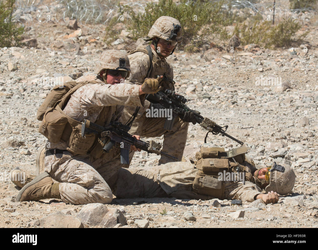 U.S. Marines with 3rd Battalion, 8th Marines, 2nd Marine Division (MARDIV), engage in a platoon attack drill during Integrated Training Exercise (ITX) 3-15 at Marine Corps Air Ground Combat Center Twentynine Palms, Calif., May 2, 2015. 6th Marines and subordinate units participated in ITX 3-15 to ensure all elements of Special-Purpose Marine Air Ground Task Force 6 are prepared for upcoming deployments and operational commitments. (U.S. Marine Corps photo by Staff Sgt. Keonaona C. Paulo 2D MARDIV Combat Camera/Released) ITX 3-15 150502-M-EF955-226 Stock Photo