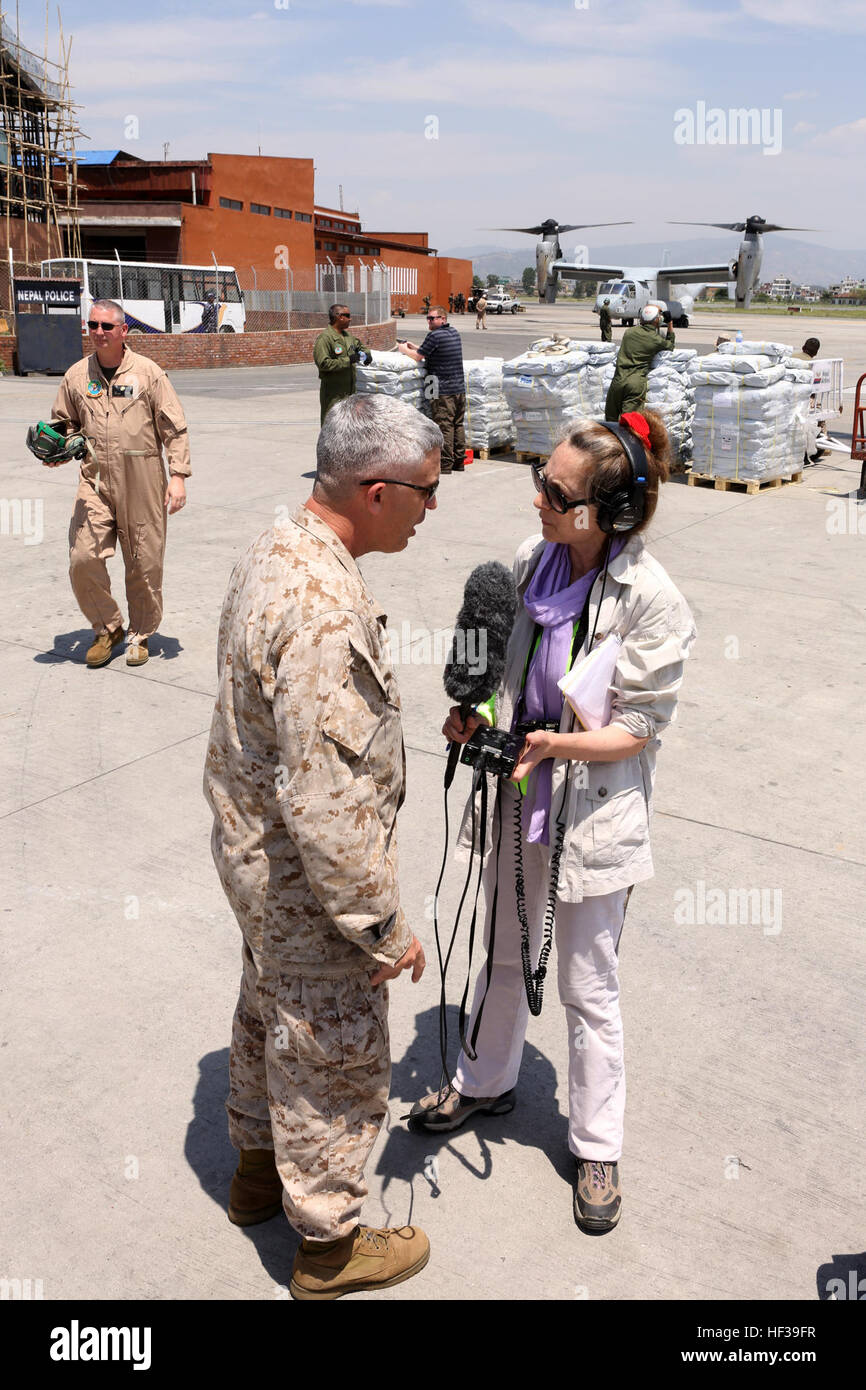 U.S. Marine Corps Brig. Gen. Paul Kennedy, Bloomfield, Conn., talks with National Public Radio reporter Julie McCarthy prior to an MV-22 Osprey flight May 5, 2015. The Nepalese Government requested the U.S. Government’s assistance after a 7.8 magnitude earthquake struck the country, April 25, 2015. U.S. Marines from III Marine Expeditionary Force came together with other U.S. services to form Joint Task Force 505. JTF-505 will work in conjunction with USAID and the international community to provide unique capabilities to assist Nepal. (U.S. Marine Corps photo by MCIPAC Combat Camera CWO3 Clin Stock Photo