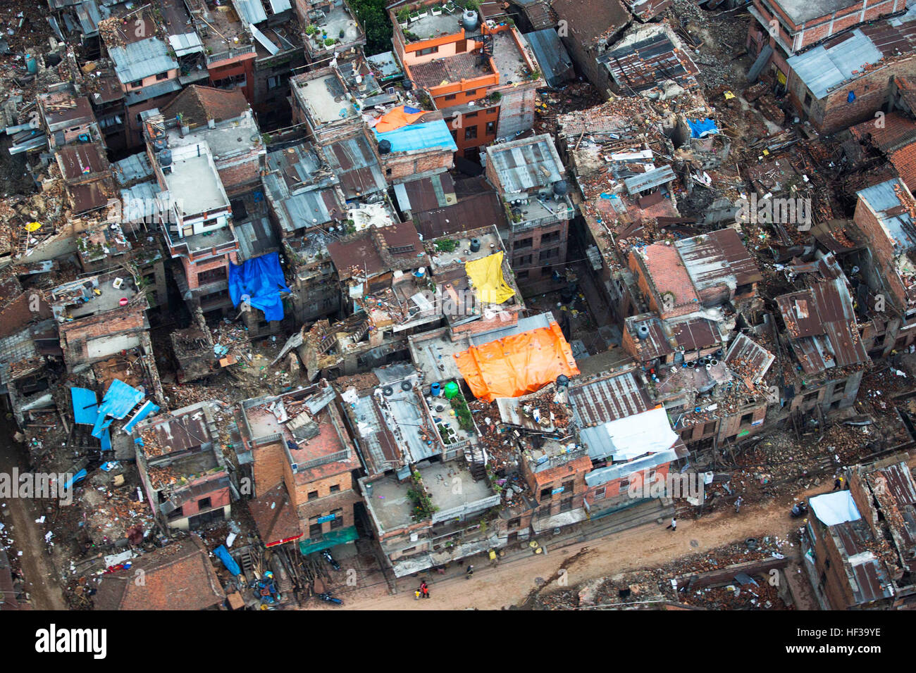 Aerial imagery, taken during a joint mission between soldiers with the Nepalese army and the Joint Task Force 505 delivering aid and relief supplies, shows areas affected by an earthquake in the Sindhuli District, Nepal, May, 10, during OPERATION SAHAYOGI HAAT. The Nepalese Government requested the U.S. Government’s assistance after a 7.8 magnitude earthquake struck the country, April 25. The U.S. government ordered JTF 505 to provide unique capabilities to assist Nepal. (U.S. Marine Corps photo by MCIPAC Combat Camera Staff Sgt. Jeffrey D. Anderson/Released) Hires 150508-M-WN441-131A An aeria Stock Photo
