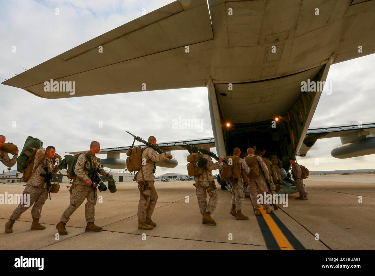 U.S. Marines with India Company, Battalion Landing Team 3rd Battalion, 1st Marine Regiment, 15th Marine Expeditionary Unit board a KC-130J Hercules aboard Marine Corps Air Station Miramar, Calif., May 13, 2015. The Marines of BLT 3/1 head to Hawaii for sustainment training before boarding the USS Anchorage (LPD-23) for their deployment through the Pacific and Central Command area. (U.S. Marine Corps photo by Sgt. Jamean Berry/Released) Leaving on a jet plane, 3-1 Marines depart for Hawaii 150513-M-GC438-023 Stock Photo