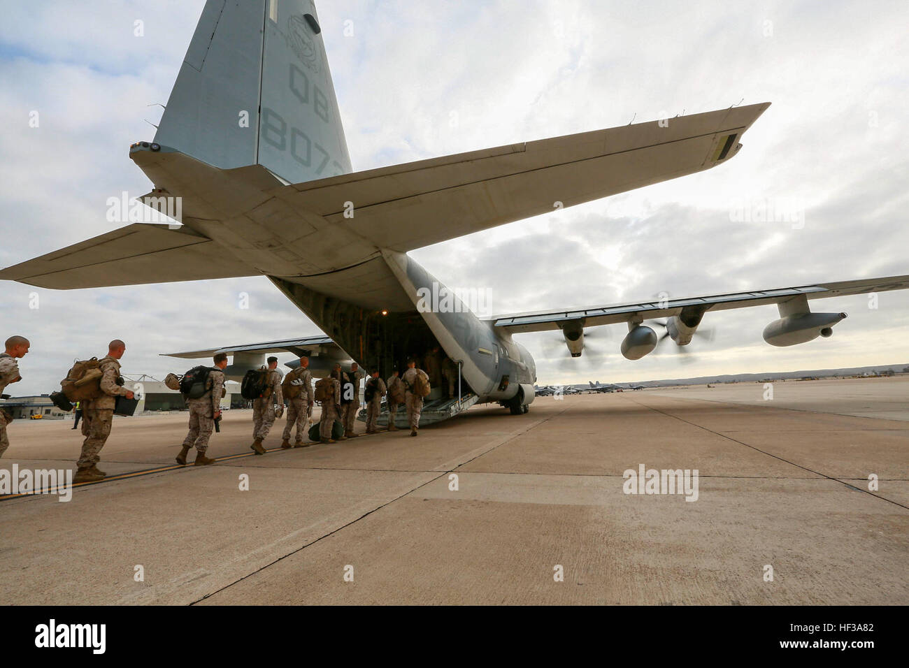 U.S. Marines with India Company, Battalion Landing Team 3rd Battalion, 1st Marine Regiment, 15th Marine Expeditionary Unit, board a KC-130J Hercules aboard Marine Corps Air Station Miramar, Calif., May 13, 2015. The Marines of BLT 3/1 head to Hawaii for sustainment training before boarding the USS Anchorage (LPD-23) for their deployment through the Pacific and Central Command area. (U.S. Marine Corps photo by Sgt. Jamean Berry/Released) Leaving on a jet plane, 3-1 Marines depart for Hawaii 150513-M-GC438-036 Stock Photo