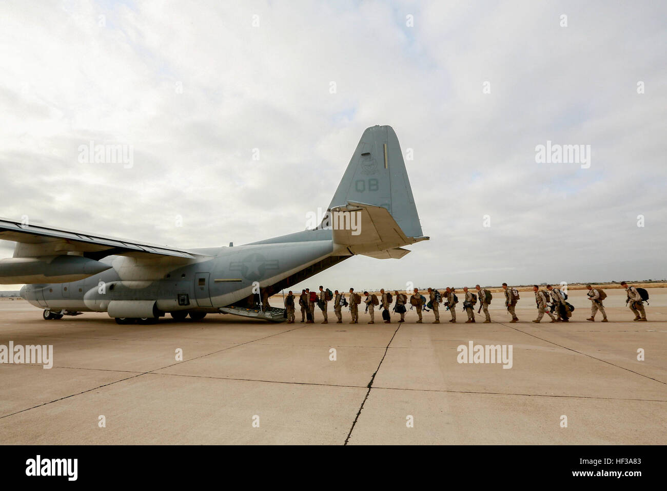 U.S. Marines with India Company, Battalion Landing Team 3rd Battalion, 1st Marine Regiment, 15th Marine Expeditionary Unit, board a KC-130J Hercules aboard Marine Corps Air Station Miramar, Calif., May 13, 2015. The Marines of BLT 3/1 head to Hawaii for sustainment training before boarding the USS Anchorage (LPD-23) for their deployment through the Pacific and Central Command area. (U.S. Marine Corps photo by Sgt. Jamean Berry/Released) Leaving on a jet plane, 3-1 Marines depart for Hawaii 150513-M-GC438-047 Stock Photo