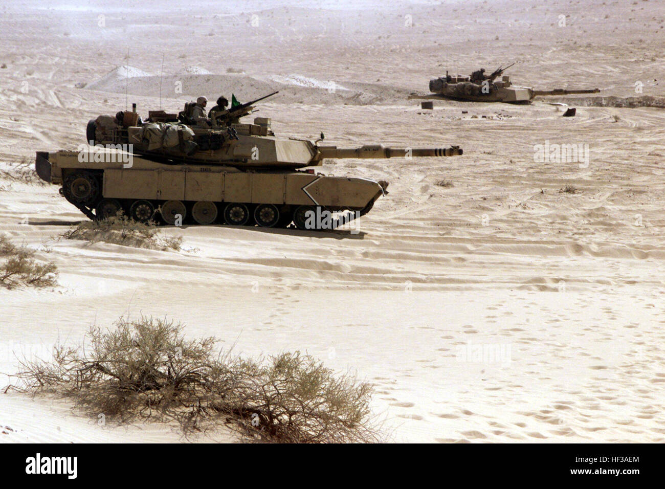 001122-M-6514O-010 Two U.S. Marine Corps M1-A1 Main Battle Tanks sit in defensive positions as they prepare to engage targets on Range 2 of the Al Hamra Training Area in the United Arab Emirates on Nov. 22, 2000.  U.S. Marines from the 13th Marine Expeditionary Unit (Special Operations Capable) are deployed from the USS Tarawa (LHA 1) to the training area for Exercise Iron Magic.  DoD photo by Cpl. Branden P. O'Brien, U.S. Marine Corps. Defense.gov News Photo 001122-M-6514O-010 Stock Photo