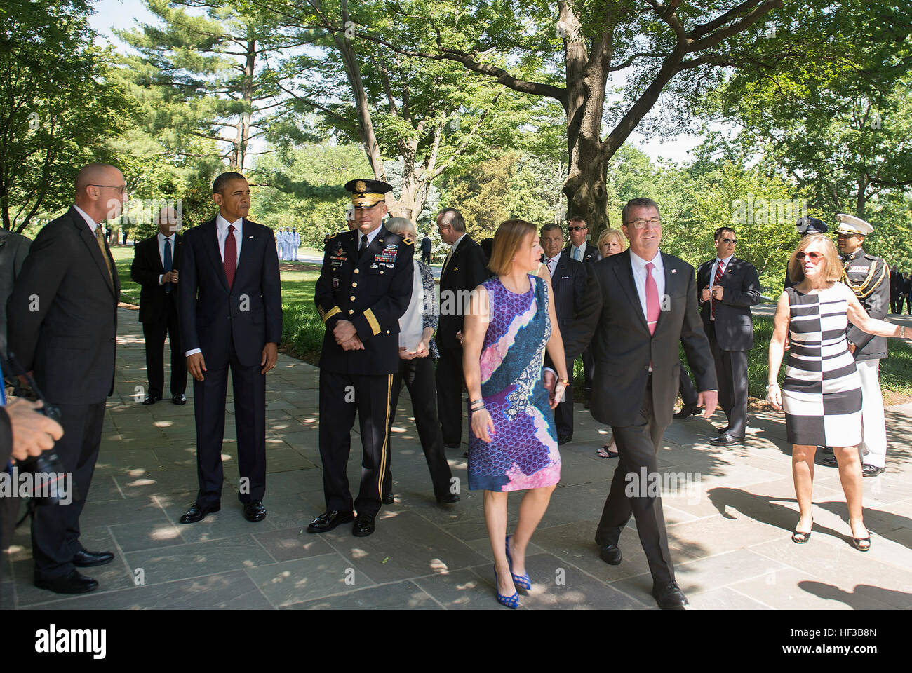 Secretary of Defense Ash Carter and his wife attend a ceremony at Arlington National Cemetery in Arlington, Va., where President Barack Obama placed a wreath at the Tomb of the Unknown Soldier to observe Memorial Day, May 25, 2015. (Photo by Master Sgt. Adrian Cadiz)(Released) SD attends Memorial Day Ceremony 150525-D-DT527-112 Stock Photo