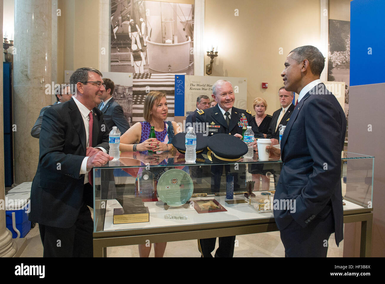 Secretary of Defense Ash Carter, his wife Stephanie, and Chairman of the Joint Chiefs of Staff Gen. Martin Dempsey speak with President Barack Obama shortly after the President laid a wreath at the Tomb of the Unknown Soldier to observe Memorial Day at Arlington National Cemetery in Arlington, Va., May 25, 2015. (Photo by Master Sgt. Adrian Cadiz)(Released) SD attends Memorial Day Ceremony 150525-D-DT527-233 Stock Photo