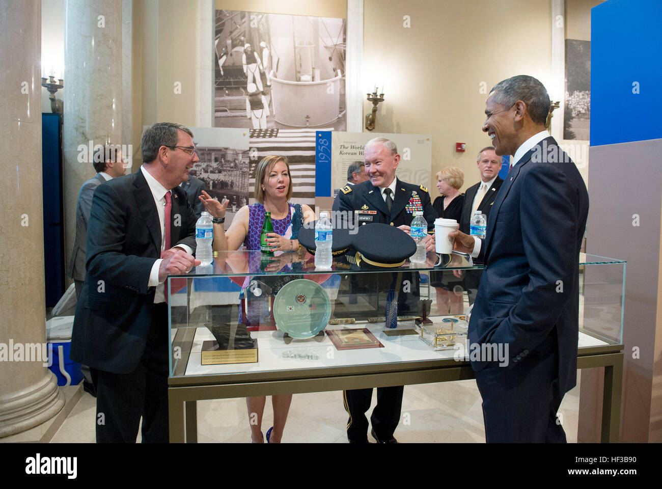 Secretary of Defense Ash Carter, his wife Stephanie, and Chairman of the Joint Chiefs of Staff Gen. Martin Dempsey speak with President Barack Obama shortly after the President laid a wreath at the Tomb of the Unknown Soldier to observe Memorial Day at Arlington National Cemetery in Arlington, Va., May 25, 2015. (Photo by Master Sgt. Adrian Cadiz)(Released) SD attends Memorial Day Ceremony 150525-D-DT527-237 Stock Photo