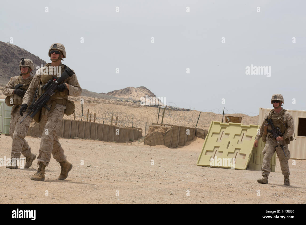 U.S. Marines with Kilo Company, 3rd Battalion, 8th Marines (3/8), conduct an embassy reinforcement during Integrated Training Exercise (ITX) 3-15 aboard Marine Corps Air Ground Combat Center Twentynine Palms, Calif., May 26, 2015. 6th Marines and subordinate units participated in ITX 3-15 to ensure all elements of Special-Purpose Marine Air Ground Task Force 6 (SPMAGTF-6) are prepared for upcoming deployments and operational commitments. (U.S. Marine Corps photo by Staff Sgt. Keonaona C. Paulo 2D MARDIV Combat Camera/Released) ITX 3-15 150526-M-EF955-404 Stock Photo