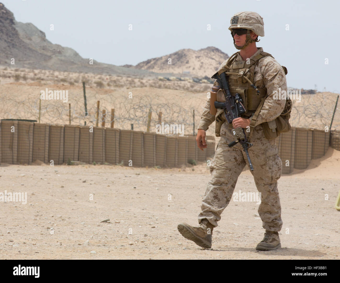 A U.S. Marine with Kilo Company, 3rd Battalion, 8th Marines (3/8), conducts an embassy reinforcement during Integrated Training Exercise (ITX) 3-15 aboard Marine Corps Air Ground Combat Center Twentynine Palms, Calif., May 26, 2015. 6th Marines and subordinate units participated in ITX 3-15 to ensure all elements of Special-Purpose Marine Air Ground Task Force 6 (SPMAGTF-6) are prepared for upcoming deployments and operational commitments. (U.S. Marine Corps photo by Staff Sgt. Keonaona C. Paulo 2D MARDIV Combat Camera/Released) ITX 3-15 150526-M-EF955-406 Stock Photo