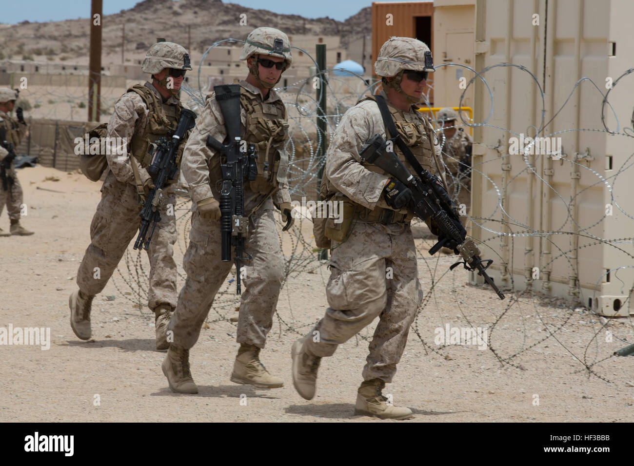 U.S. Marines with Kilo Company, 3rd Battalion, 8th Marines (3/8), conduct an embassy reinforcement during Integrated Training Exercise (ITX) 3-15 aboard Marine Corps Air Ground Combat Center Twentynine Palms, Calif., May 26, 2015. 6th Marines and subordinate units participated in ITX 3-15 to ensure all elements of Special-Purpose Marine Air Ground Task Force 6 (SPMAGTF-6) are prepared for upcoming deployments and operational commitments. (U.S. Marine Corps photo by Staff Sgt. Keonaona C. Paulo 2D MARDIV Combat Camera/Released) ITX 3-15 150526-M-EF955-467 Stock Photo