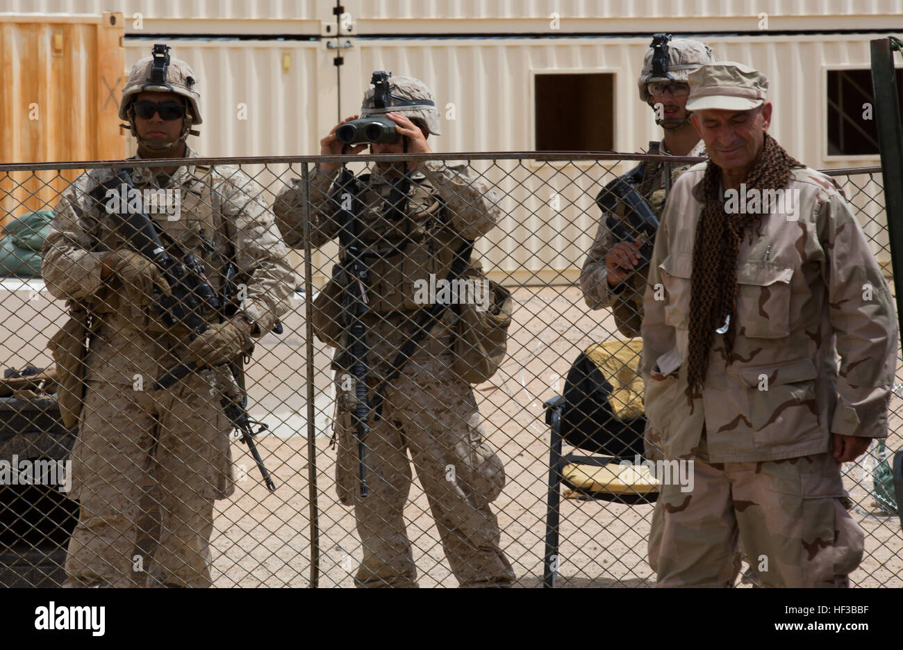 U.S. Marines with Kilo Company, 3rd Battalion, 8th Marines (3/8), conduct an embassy reinforcement during Integrated Training Exercise (ITX) 3-15 aboard Marine Corps Air Ground Combat Center Twentynine Palms, Calif., May 26, 2015. 6th Marines and subordinate units participated in ITX 3-15 to ensure all elements of Special-Purpose Marine Air Ground Task Force 6 (SPMAGTF-6) are prepared for upcoming deployments and operational commitments. (U.S. Marine Corps photo by Staff Sgt. Keonaona C. Paulo 2D MARDIV Combat Camera/Released) ITX 3-15 150526-M-EF955-483 Stock Photo