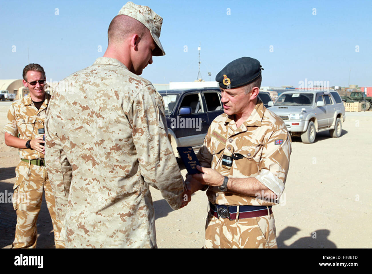 ritish Royal Air Force Air Commodore Stuart Atha, air officer commanding of the 83rd Expeditionary Air Group, presents Staff Sgt. William Chesnutt, an air traffic controller from Marine Aircraft Control Group 28, with a British Certificate of Competency for air traffic control at Camp Bastion, Helmand province, Afghanistan, Sept. 9, 2009. Chesnutt is one of the first two Marines in British aviation history to receive the certificate, also known as the Blue Book. (U.S. Marine Corps photo by Sgt. Timothy Brumley) MACG-28 Marines First to Receive British Air Traffic Control Certification DVIDS205 Stock Photo