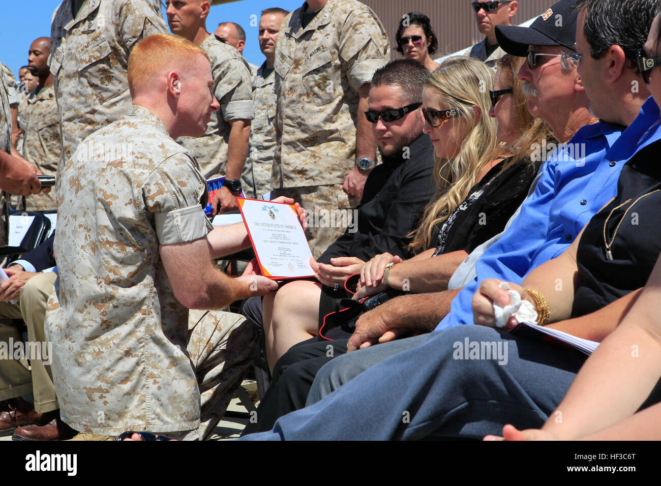 Samantha Seaman widow to U.S. Marine Sgt. Eric Seaman a UH-1H Huey helicopter crew chief with Marine Light Attack Helicopter Squadron 469, posthumously receives his Joint Service Commendation Medal at Marine Corps Base Camp Pendleton, Calif., June 3, 2015. The memorial service was honoring the six U.S. Marines that lost their lives while supporting Operation Sahayogi Haat 'Helping Hand' in Kathmandu, Nepal. (U.S. Marine Corps photo by LCpl. Jeremy L. Laboy, 3rd Marine Aircraft Wing) Memorial Service Honoring Six U.S. Marines That lLost Their Lives While Supporting Operation Sahayogi Haat 'Help Stock Photo