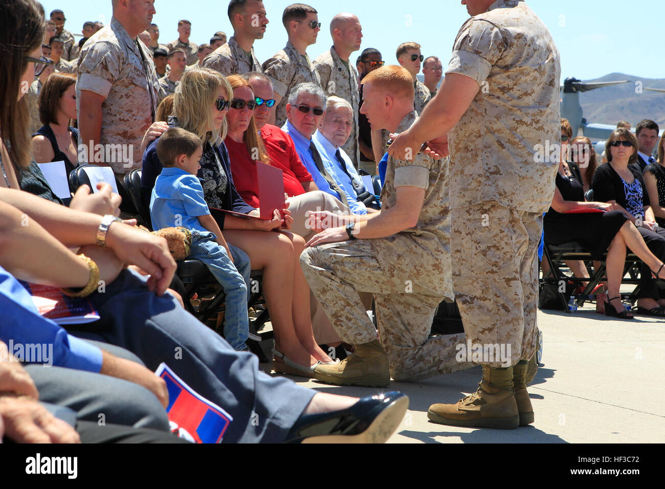 Haley Vaughters Johnson widow to U.S. Marine Sgt. Mark Johnson a UH-1H Huey helicopter crew chief with Marine Light Attack Helicopter Squadron 469, posthumously receives his Joint Service Commendation Medal at Marine Corps Base Camp Pendleton, Calif., June 3, 2015. The memorial service was honoring the six U.S. Marines that lost their lives while supporting Operation Sahayogi Haat 'Helping Hand' in Kathmandu, Nepal. (U.S. Marine Corps photo by LCpl. Jeremy L. Laboy, 3rd Marine Aircraft Wing) Memorial Service Honoring Six U.S. Marines That Lost Their Lives While Supporting Operation Sahayogi Ha Stock Photo