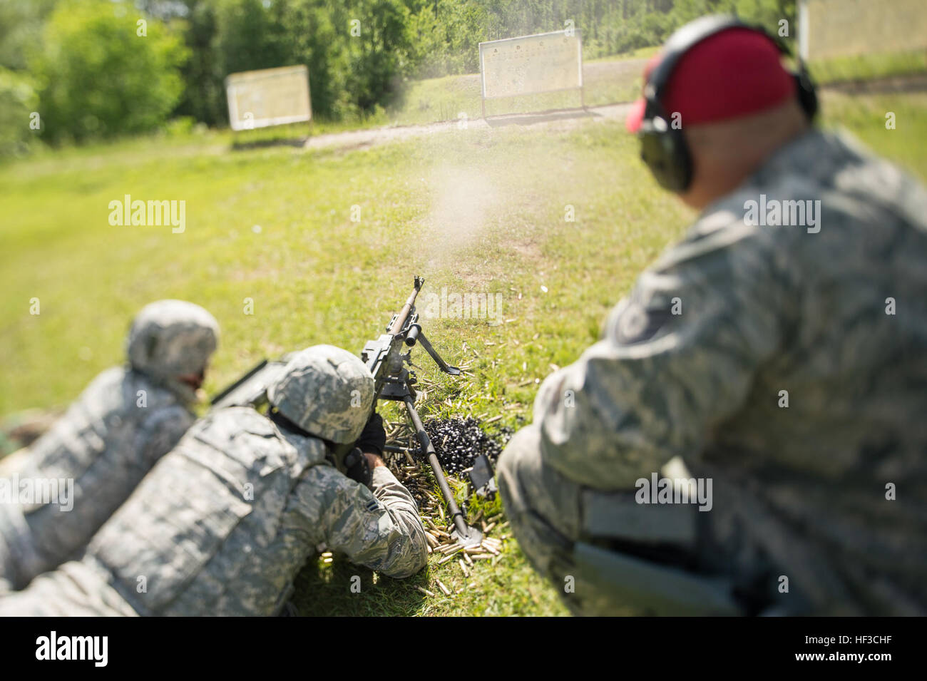 U.S. airmen with the 158th Fighter Wing Security Forces Squadron participate in annual proficiency training by firing hundreds of rounds with the M240B and M249 machine guns at the Camp Ethan Allen Training Site in Jerhico, Vt., June 7. The annual training allows Airmen to fire heavy machine guns to hone in on their individual and team skills as well as their weaponry tactics. (U.S. Air Force Photo by Senior Airmen Jonathon Alderman) Home on the Range 150607-Z-QG327-545 Stock Photo