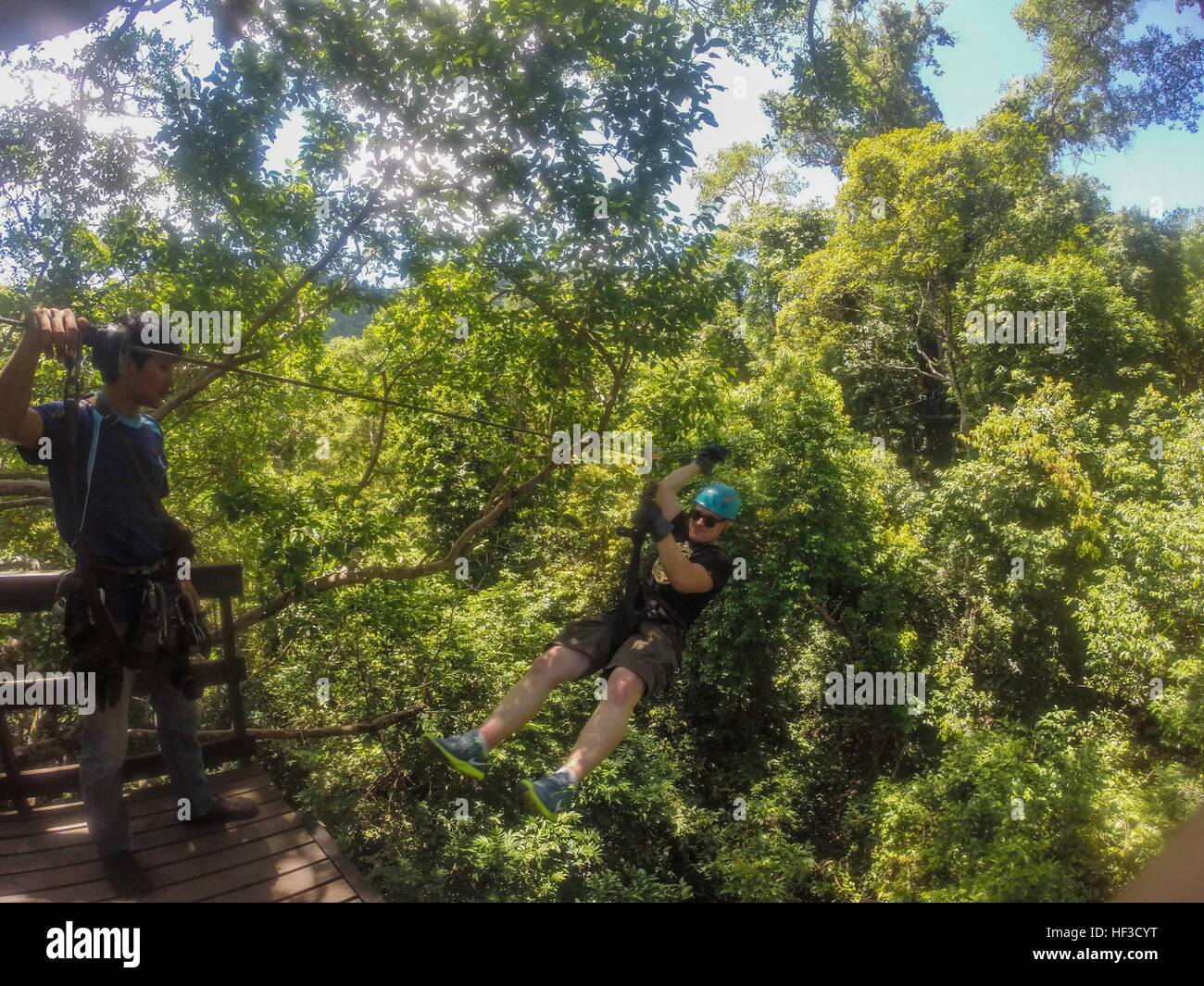 A U.S. Marine with the 15th Marine Expeditionary Unit participates in a zip-line tour through the jungles of Pattaya Beach, Thailand, June 10, 2015.  Marines and Sailors aboard the USS Anchorage (LPD 23) enjoyed various leisure activities during a port visit in Thailand. (U.S. Marine Corps photo by Sgt. Jamean Berry/Released) U.S. Marines, Sailors explore Thailand during port visit 150610-M-GC438-007 Stock Photo