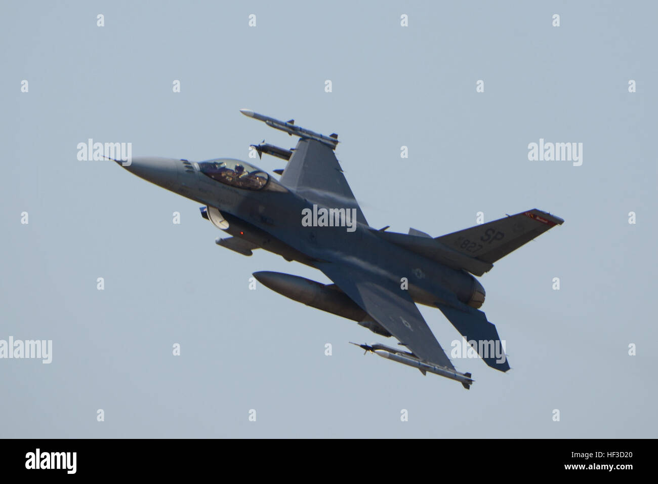 A  U.S. Air Force F-16 fighter jet, assigned to the 52nd Fighter Wing from Spangdahlem, Germany, returns to Łask Air Base after a mission in support of Operation Atlantic Resolve, June 12, 2015. Mult-national F-16 fighters have been operating from Łask Air Base to participate in exercises such as Ramstein Guard, Saber Strike and BALTOPS. U.S. Air Force Airmen from Spangdahlem Air Base, Germany and the South Carolina Air Guard’s 169th Fighter Wing from McEntire Joint National Guard Base, are deployed to Łask Air Base in support of Operation Atlantic Resolve, during the month of June. These trai Stock Photo