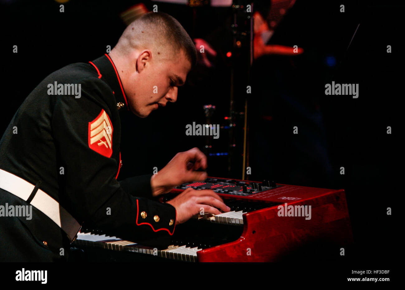 Sgt. Devin Penner plays the keyboard during a concert at the Lincoln Center in Manhattan on March 8. Penner, a native of Red Bluff, Calif., is a pianist for the Quantico Marine Band at Marine Corps Base Quantico, Va. The Marine Corps Jazz Ensemble is performing at several high schools and universities in the Greater New York City and Boston areas with exceptional music programs to promote the Corps' Musician Enlistment Option Program. This concert was the capstone of their tour throughout the Northeast region.  (U.S. Marine Corps photo by Sgt. Caleb Gomez) Marine Corps Jazz Ensemble perform at Stock Photo