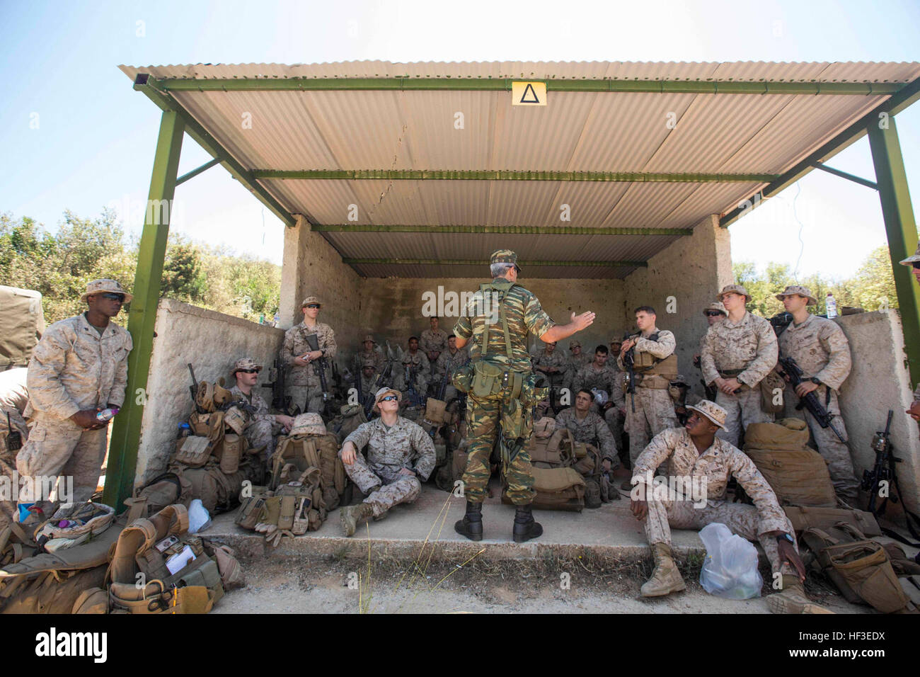 Marines with India Company, Battalion Landing Team 3rd Battalion, 6th  Marine Regiment, 24th Marine Expeditionary Unit, receive a welcome aboard  brief from Lt. Col. Christou Ioannis, commander of the 521st Marine  Battalion,