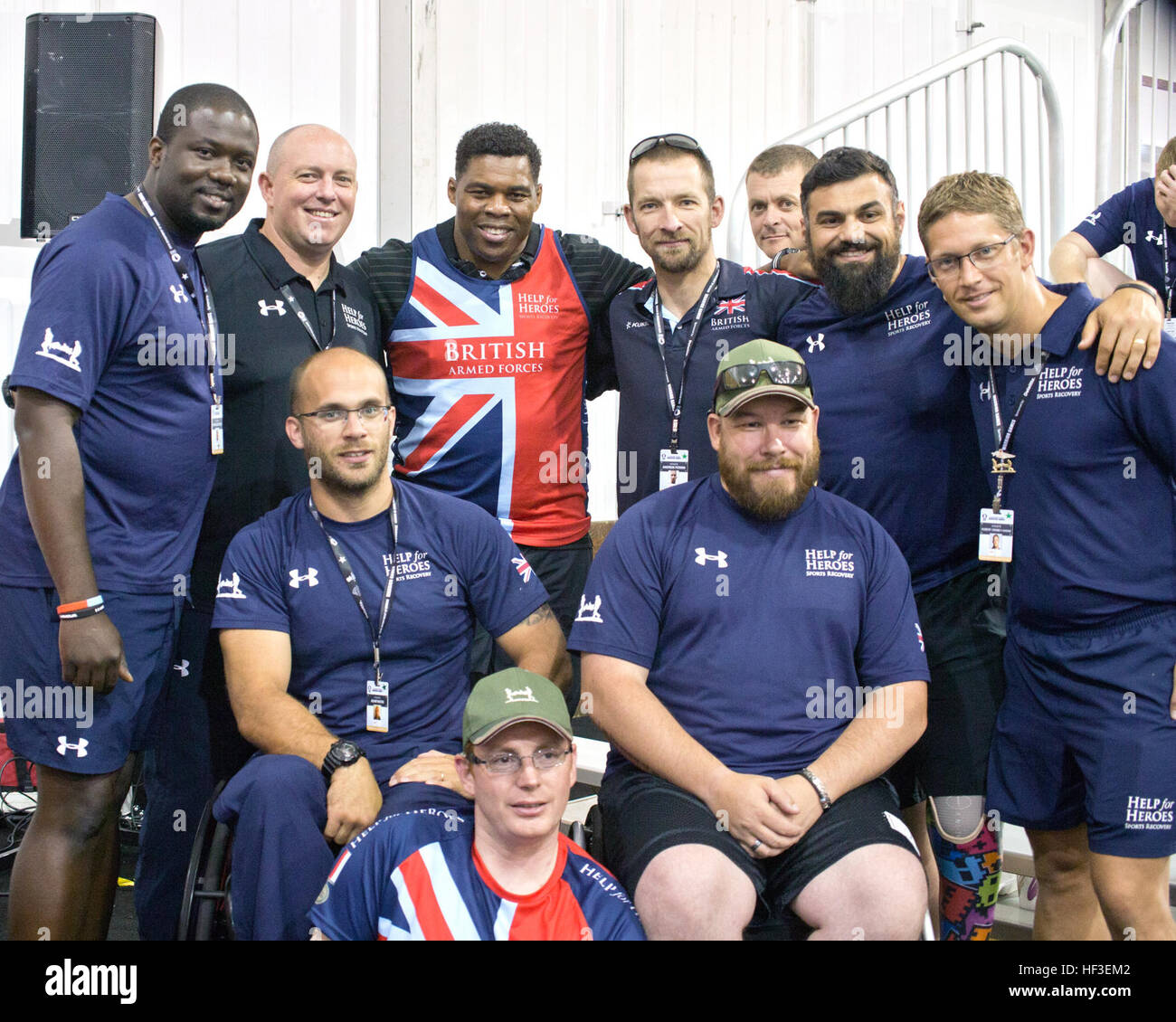 Retired professional football player and 1982 Heisman Trophy winner Herschel Walker takes his place amongst newfound friends from the United Kingdom, Team British Armed Forces. Walker visited with competitors during the 2015 DoD Warrior Games on Marine Corps Base Quantico. Walker has journeyed to each Warrior Games since its inception and has no intention of stopping. “These are true athletes,” Walker said. “Watching their determination is an inspiration to me.” (U.S. Army photo by AW2 Staff Sgt. Tracy J. Smith) Team Army set sights on gold for Day 5 of the 2015 Warrior Games 150626-Z-PA893-00 Stock Photo