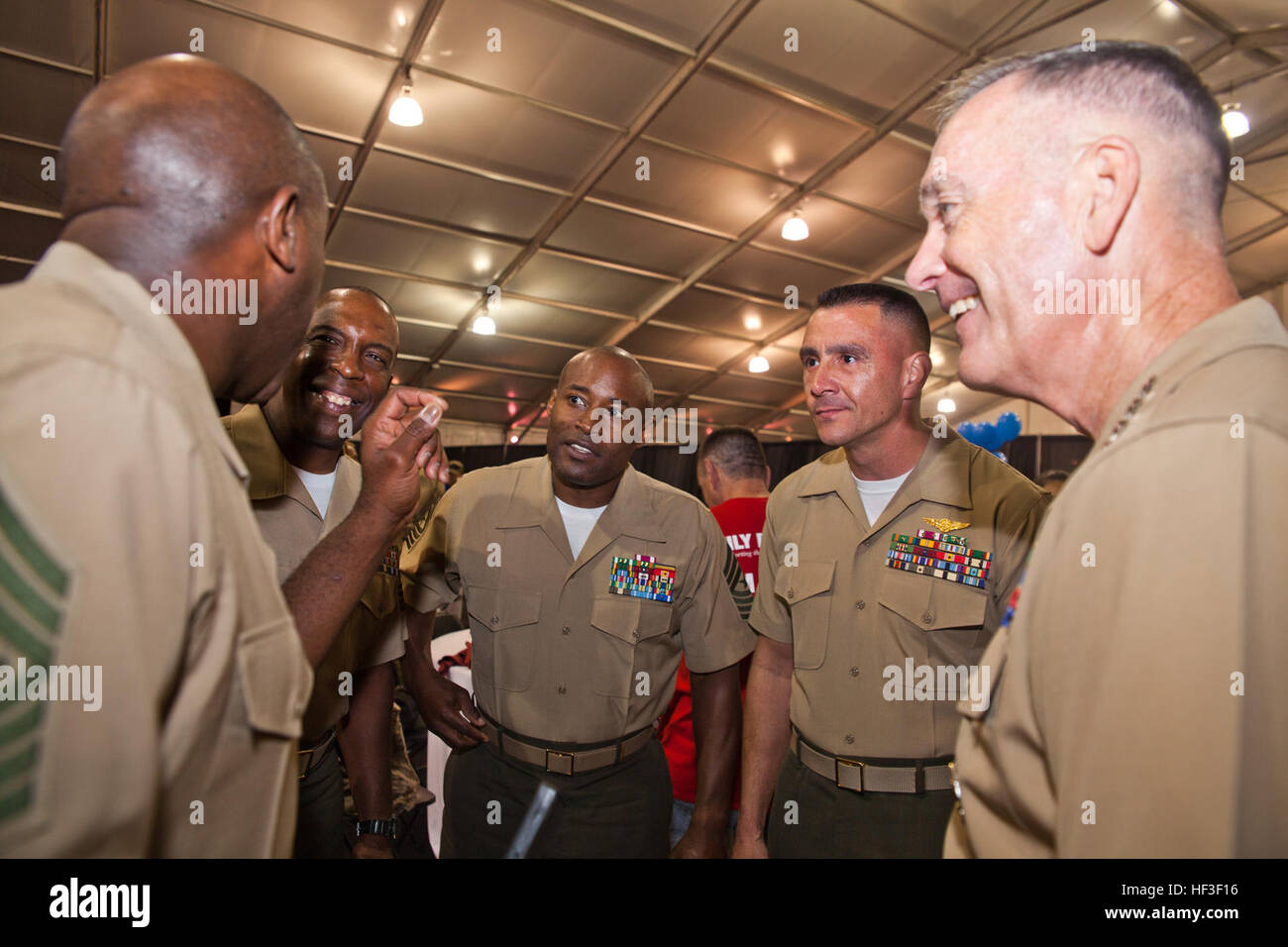 Sgt. Maj. of the Marine Corps Ronald L. Green, left, talks with Commandant of the Marine Corps Gen. Joseph F. Dunford Jr., right, and other sergeants major during the 2015 Department of Defense Warrior Games at Marine Corps Base Quantico, Va., June 28, 2015. Dunford spoke during the closing ceremony of the games. (U.S. Marine Corps photo by Sgt. Gabriela Garcia/Released) 2015 DoD Warrior Games CMC Closing Ceremony Remarks 150628-M-SA716-119 Stock Photo