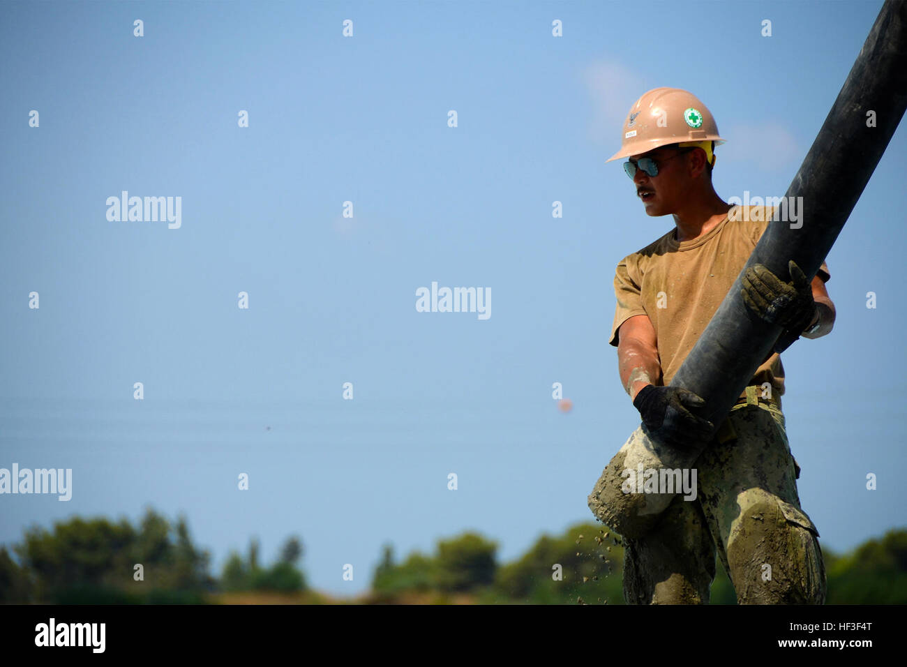 U.S. Navy Builder Constructionman 2nd Class Martin Riddle, a Seabee ...