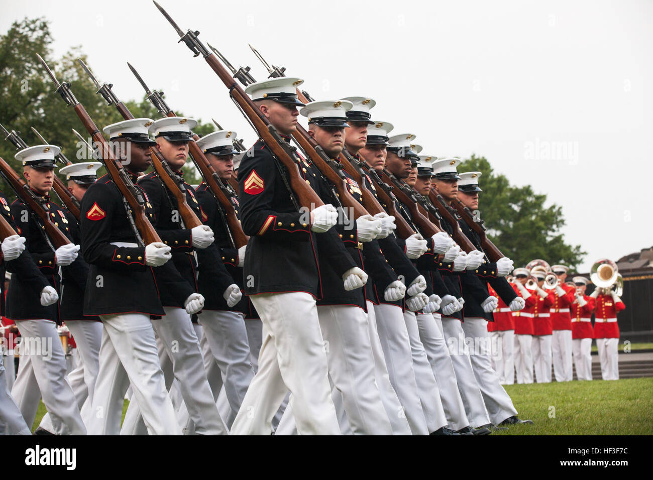 The U.S. Marine Corps Silent Drill Platoon performs during a sunset ...