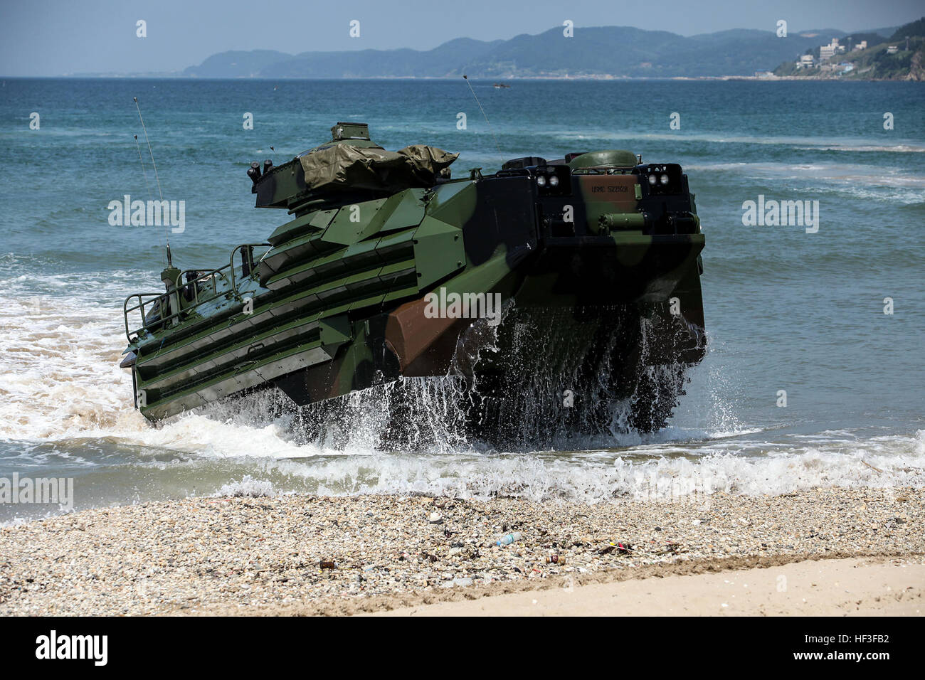 A U.S. Marine Corps Amphibious Assualt Vehicle (AAV) with Alpha Company, 4th Assault Amphibian Battalion, 4th Marine Division, Marine Forces Reserve hits the surf during the amphibious operations portion of Korean Marine Exchange Program 15-8 at Deagu Beach in Pohang, South Korea as a part of Peninsula Express 15, July 1, 2015. Peninsula Express is one in a series of regularly-scheduled combined, small-unit, tactical training exercises that demonstrates continued dedication to the ROK-U.S. relationship, contributing to the security and stability of the Korean Peninsula and Asia-Pacific region. Stock Photo