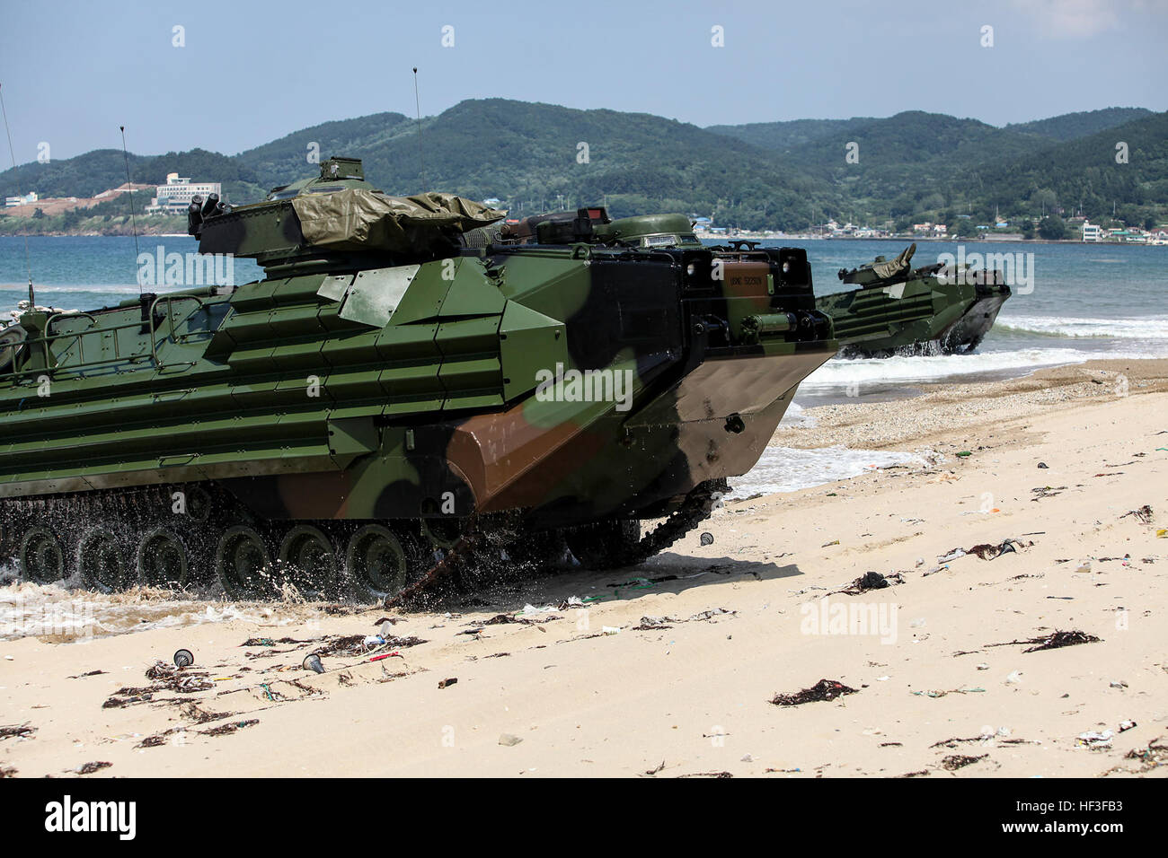 U.S. Marine Corps Amphibious Assualt Vehicles (AAV) with Alpha Company, 4th Assault Amphibian Battalion, 4th Marine Division, Marine Forces Reserve hits the surf during the amphibious operations portion of Korean Marine Exchange Program 15-8 at Deagu Beach in Pohang, South Korea as a part of Peninsula Express 15, July 1, 2015. Peninsula Express is one in a series of regularly-scheduled combined, small-unit, tactical training exercises that demonstrates continued dedication to the ROK-U.S. relationship, contributing to the security and stability of the Korean Peninsula and Asia-Pacific region.  Stock Photo