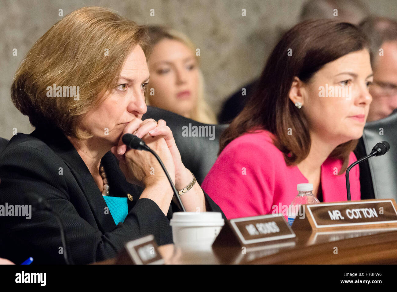 U.S. Senate Committee on Armed Services member Senators Deb Fischer and Kelly Ayotte listen to testimony from 18th Chairman of the Joint Chiefs of Staff Gen. Martin E. Dempsey and Secretary of Defense Ashton B. Carter during a hearing discussing Counter-ISIL (Islamic State of Iraq and the Levant) Strategy, on Capitol Hill, July 7, 2015. (DoD photo by Army Staff Sgt. Sean K. Harp/Released) SECDEF CJCS testify before SASC on ISIL 150707-D-HU462-157 Stock Photo