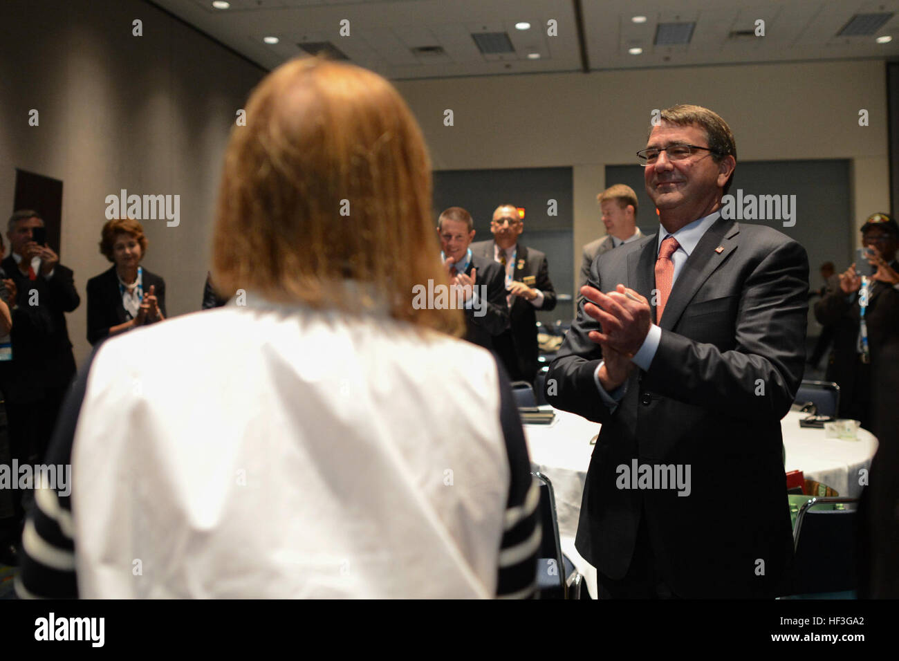 Secretary of Defense Ash Carter applauds his wife, Stephanie, for her support at the National Association of Counties convention in Charlotte, N.C., July 11, 2015. (DoD photo by Petty Officer 2nd Class Sean Hurt/ Released) Secretary of defense visits Fort Bragg 150711-D-AF077-158 Stock Photo