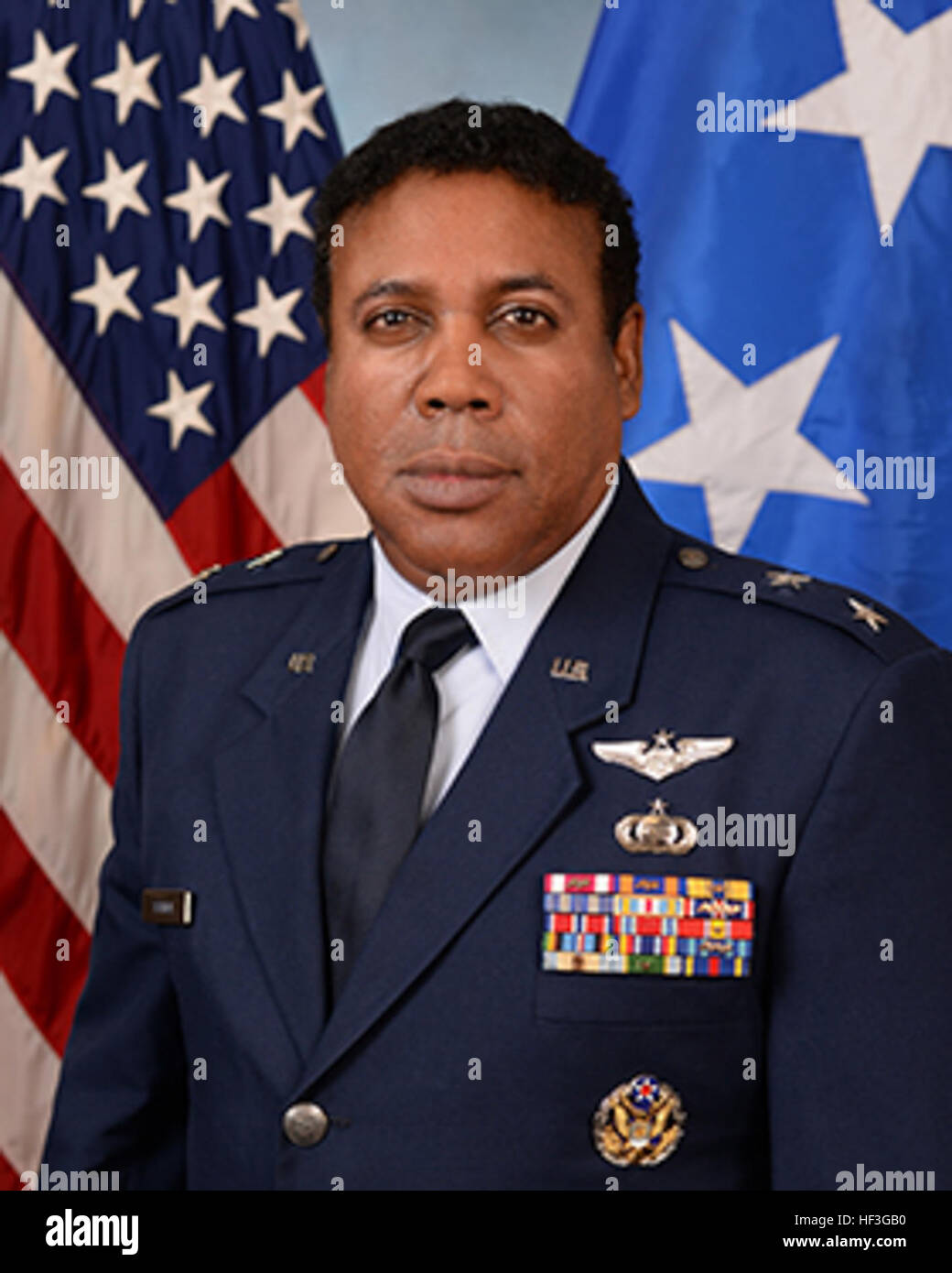 A formal portrait depicts a senior military officer in dress uniform ...