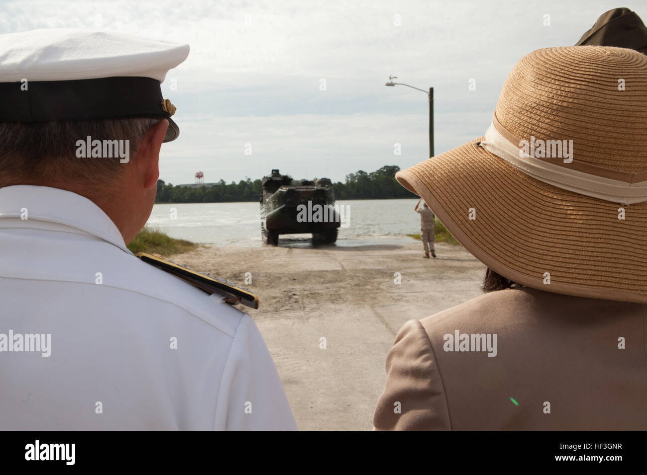 Japan's Admiral Katsutoshi Kawano, Chief of Staff, and Ms. Kazuko Sherman, Interpreter, watches as U.S. Marines with 2nd Amphibious Assault Battalion, 2nd Marine Division (MARDIV) operate a vehicle on Camp Lejeune, N.C, July 15, 2015. The purpose of the visit was to demonstrate Department of Defense support for Japan's efforts to upgrade capabilities of the Japan Self-Defense Forces to rapidly deploy air and amphibious capabilities and employ joint doctrine. (U.S. Marine Corps photo by Lance Cpl. Sarah Blendowski, 2d Marine Division, Combat Camera/Released) Japanese Chief of Staff Visit 150715 Stock Photo