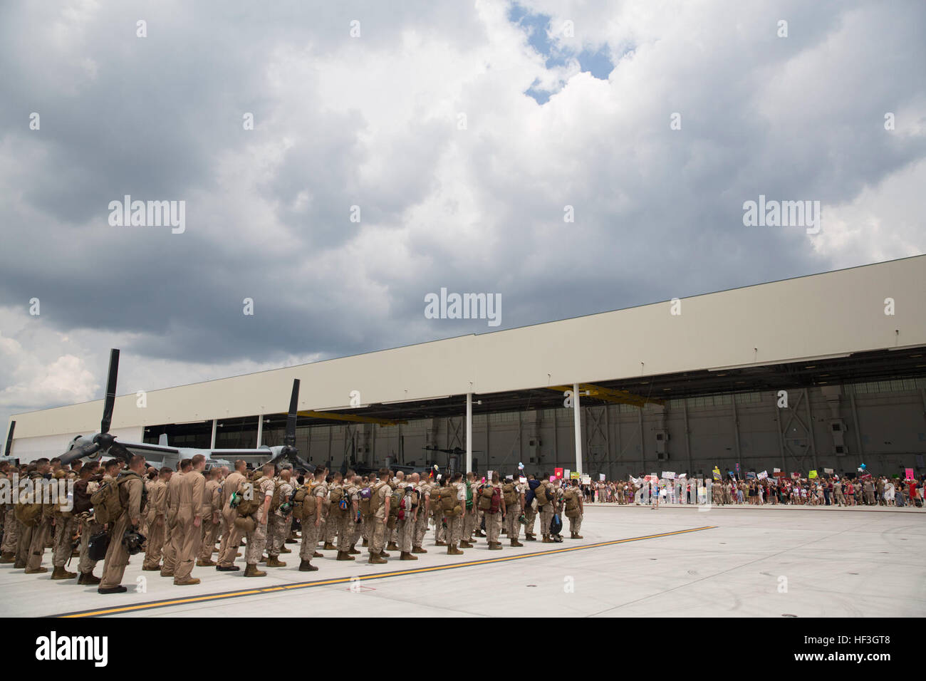 Marines with Marine Medium Tiltrotor Squadron 365 (Reinforced), 24th Marine Expeditionary Unit stand in formation prior to reuniting with their families during the Aviation Combat Element’s homecoming at Marine Corps Air Station New River, N.C. July 16, 2015. Marines and Sailors of the 24th MEU were embarked on the ships of the Iwo Jima Amphibious Ready Group and supported operations in the U.S. 5th and 6th Fleet area of operations. They also took part in numerous theater security cooperation exercises and training with allied partners such as Djibouti, Italy, Oman, Spain, France, Jordan, Isra Stock Photo