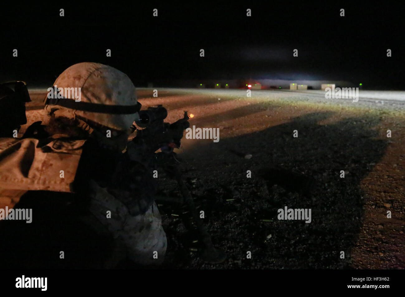 A U.S. Marine engages targets with an M240B medium machine gun during ...