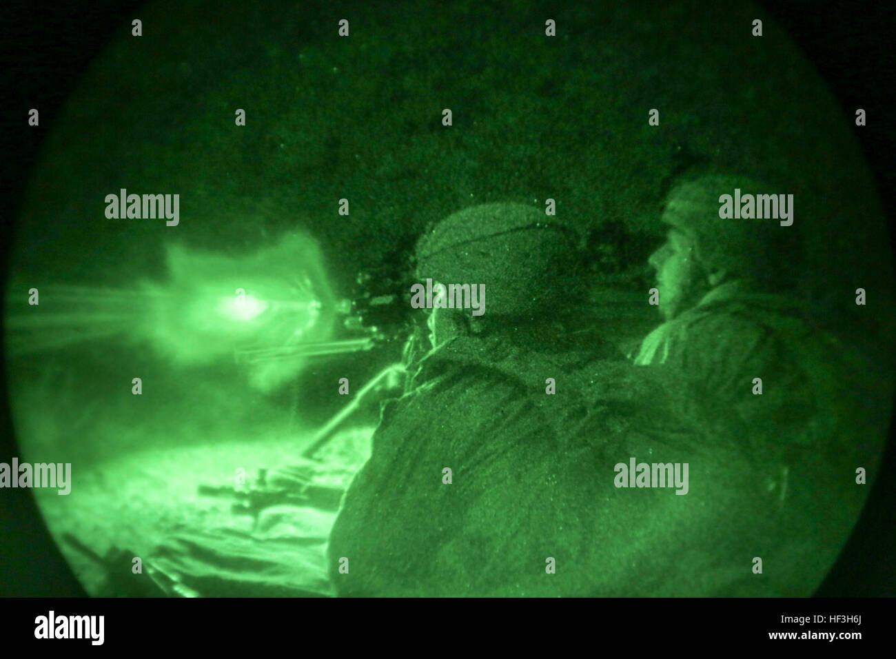 ARTA BEACH, Djibouti (July 22, 2015) U.S. Marines with Battalion Landing Team 3rd Battalion, 1st Marine Regiment, 15th Marine Expeditionary Unit, fire an M240B medium machine gun during a night-fire exercise.  The Marines of BLT 3/1 executed a series of attack and maneuver drills consisting of, machine gun, squad and night attacks.  Elements of the 15th Marine Expeditionary Unit are ashore in Djibouti for sustainment training to maintain and enhance the skills they developed during their pre-deployment training period.  The 15th MEU is currently deployed in support of maritime security operati Stock Photo