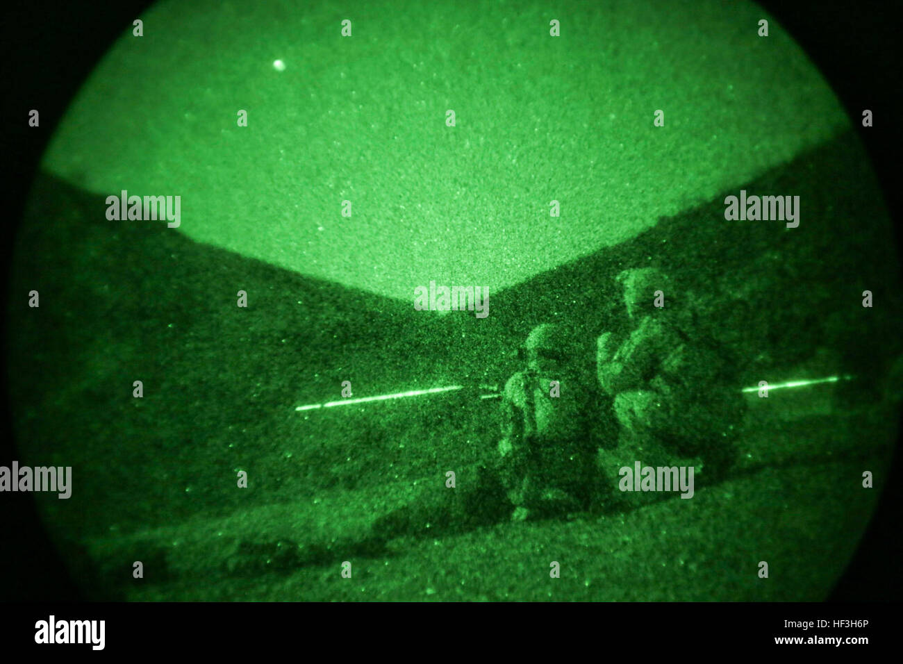 ARTA BEACH, Djibouti (July 22, 2015) U.S. Marines with Battalion Landing Team 3rd Battalion, 1st Marine Regiment, 15th Marine Expeditionary Unit, fire M4 Carbines during a night-fire exercise.  The Marines of BLT 3/1 executed a series of attack and maneuver drills consisting of, machine gun, squad and night attacks.  Elements of the 15th Marine Expeditionary Unit are ashore in Djibouti for sustainment training to maintain and enhance the skills they developed during their pre-deployment training period.  The 15th MEU is currently deployed in support of maritime security operations and theater  Stock Photo