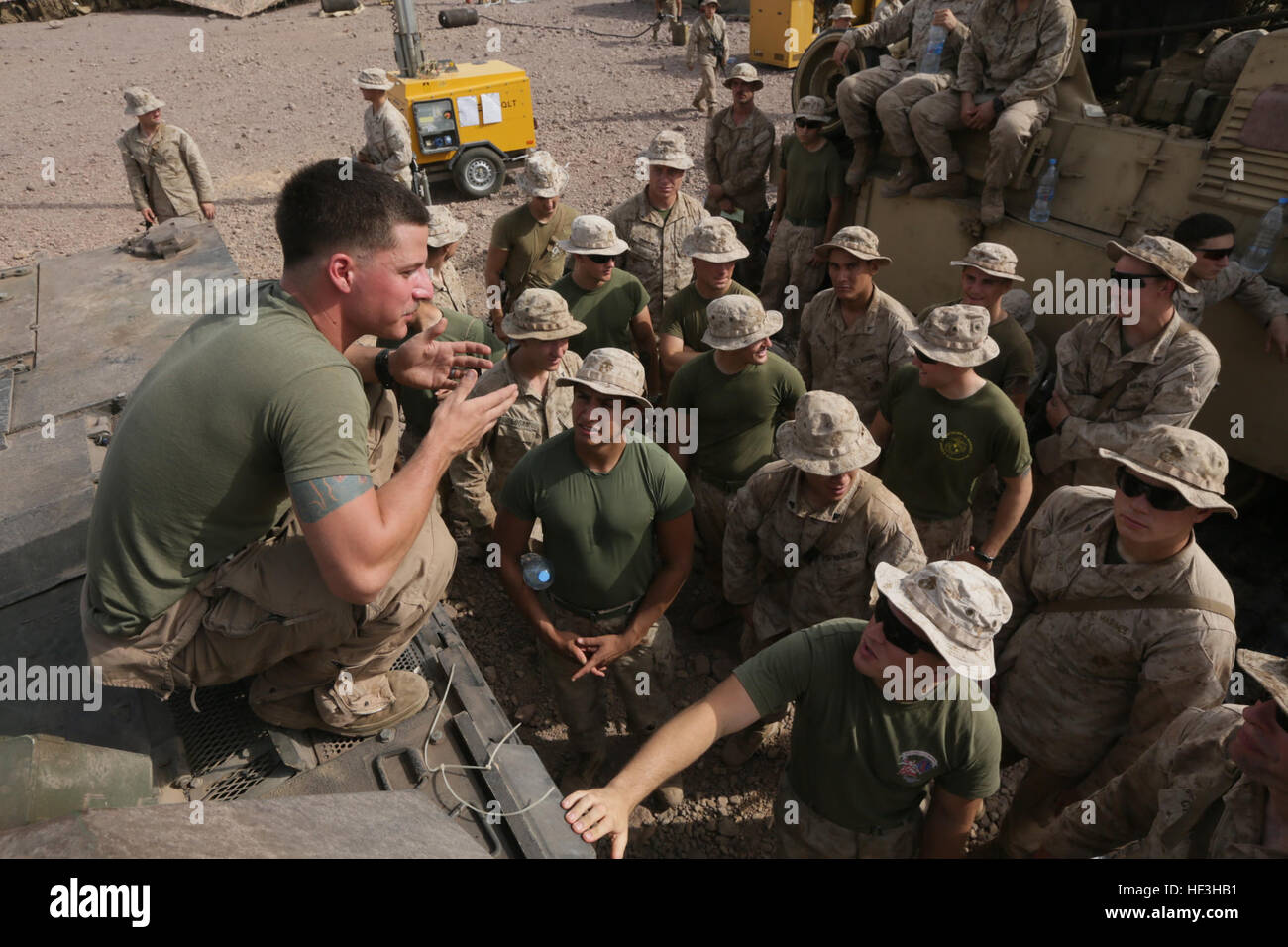 ARTA BEACH, Djibouti (July 24, 2015) U.S. Marine Lance Cpl. Donald Varilek teaches the Marines of Battalion Landing Team 3rd Battalion, 1st Marine Regiment, 15th Marine Expeditionary Unit, about the functions of an M1A1 Abrams tank. Varilek is a tank loader with BLT 3/1, 15th MEU. Elements of the 15th Marine Expeditionary Unit are ashore in Djibouti for sustainment training to maintain and enhance the skills they developed during their pre-deployment training period.  The 15th MEU is currently deployed in support of maritime security operations and theater security cooperation efforts in the U Stock Photo
