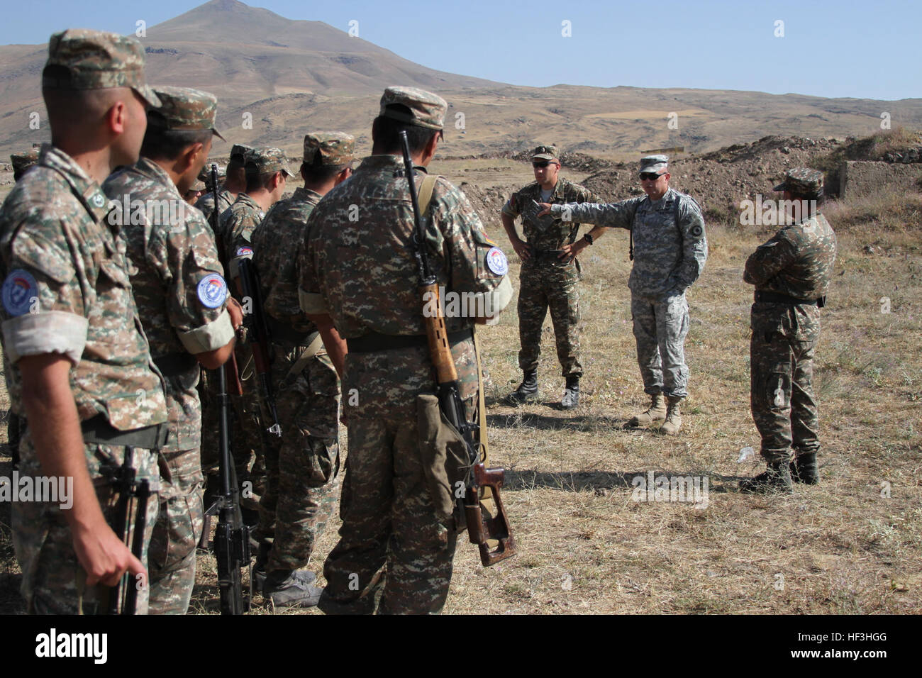 A small group of Kansas National Guardsmen assist and advise Soldiers with the Armenian Peacekeeping Brigade at the Zar Mountain Training Center, near Yerevan, Armenia, July 27 - Aug. 7, 2015, in preparation of a major NATO evaluation in September 2015. The combat readiness evaluation will be a culmination of a years-long process that would certify the interoperability of the Armenian PKB in support of NATO peacekeeping operations. Kansas and Armenia have been partnered in the National Guard Bureau's State Partnership Program since 2003. (U.S. Army National Guard photo by Sgt. Zach Sheely/Rele Stock Photo