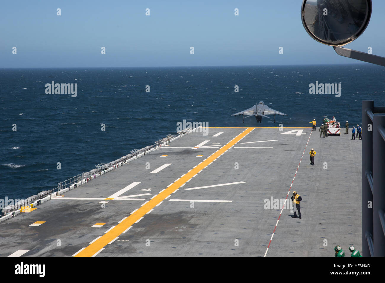 An AV-8B Harrier with Marine Attack Squadron (VMA) 214 conducts a short takeoff from the flight deck of the USS Boxer, Aug. 4. For several hours, pilots practiced taking off and landing while aboard a moving Navy ship. (U.S. Marine Corps photo by Sgt. Lillian Stephens/Released) USS Boxer sets flight quarters after Seafair Fleet Week 150804-M-QU349-157 Stock Photo