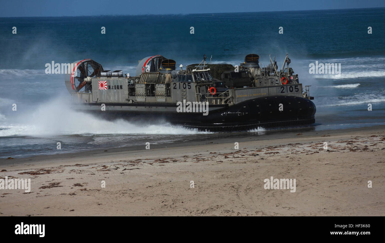A Japanese landing craft air cushion vehicle comes ashore on a Marine