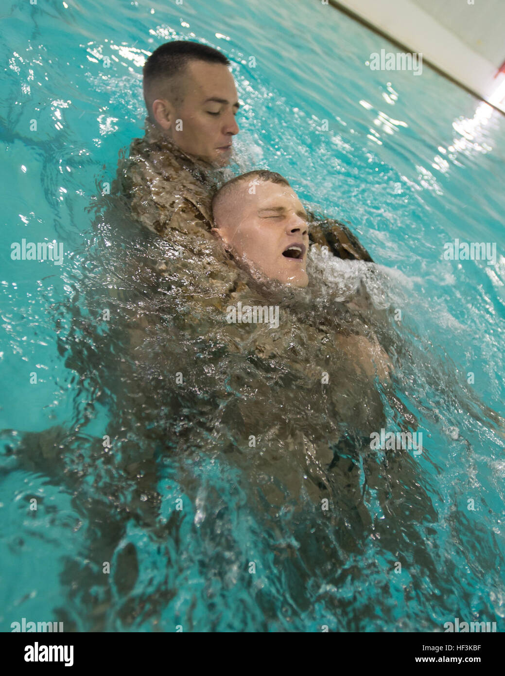 U.S. Marines with The Basic School simulate rescue techniques for the basic and intermediate swim qualification course at The Basic School, Marine Corps Base Quantico, Va., Sept. 10, 2015. The course teaches Marines water survival and tactical skills. (U.S. Marine Corps photo by Lance Cpl. Jacqueline A. Garcia/Released) The Basic School Golf Co Swim Qual 150910-M-PO745-450 Stock Photo