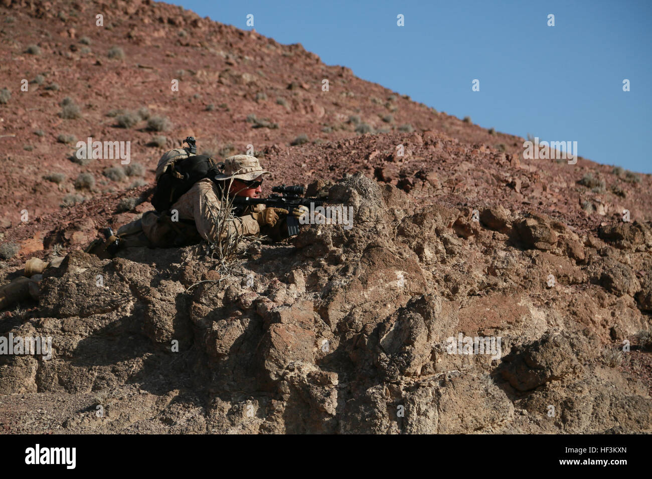 ARTA BEACH, Djibouti (Sept. 29, 2015) U.S. Marine 1st Lt. Michael Hosteny provides security for his squad during a patrolling exercise during a desert survival course with the French 5th Overseas Combined Arms Regiment (RIAOM). Hosteny is the executive officer of Delta Company, 1st Light Armored Reconnaissance Detachment, Battalion Landing Team 3rd Battalion, 1st Marine Regiment, 15th Marine Expeditionary Unit. Elements of the 15th MEU are training with the 5th RIAOM in Djibouti in order to improve interoperability between the MEU and the French military. (U.S. Marine Corps photo by Sgt. Steve Stock Photo