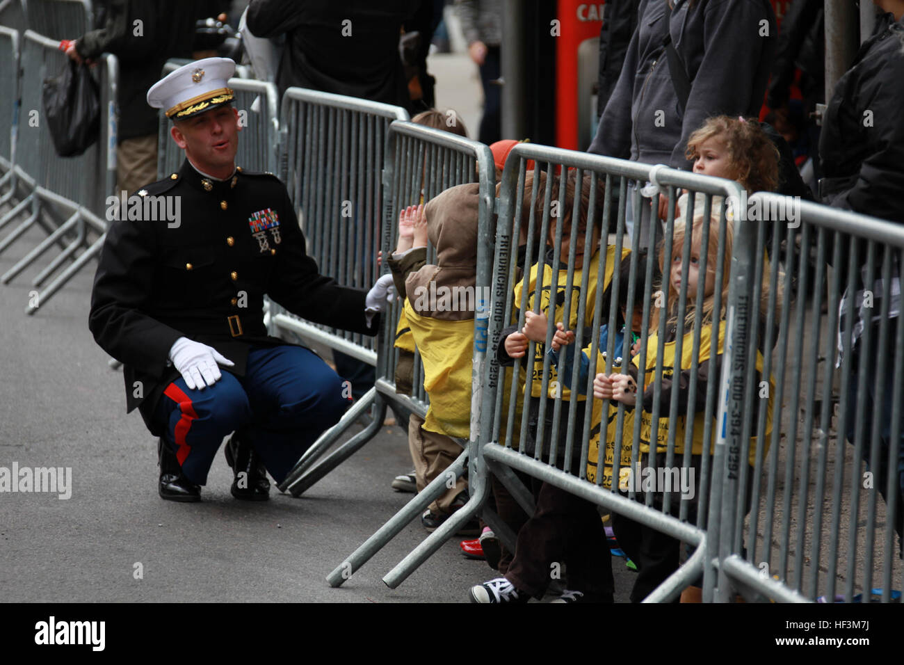 During the New York City Veterans Day parade, Lt. Col. Walter C. Sopp, speaks with 3 year old children from Preschool of America Nov. 11, 2009. Sopp is the executive officer of Special Purpose Marine Air Ground Task Force 26, a unit formed to showcase Marine Corps personnel, aircraft, vehicles and equipment while docked at Pier 88 for the USS New York commissioning. Veterans Day DVIDS223307 Stock Photo