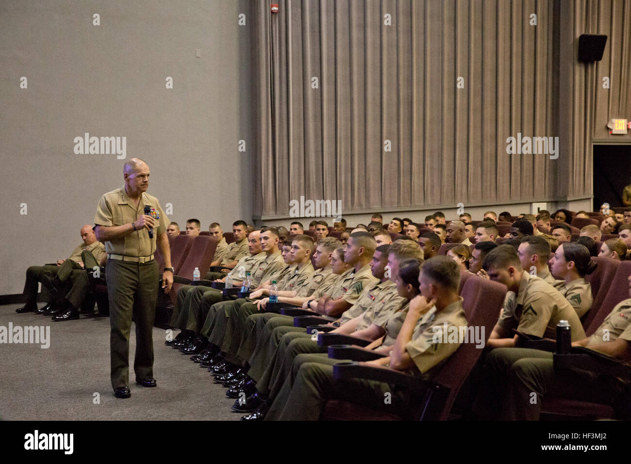 Commandant of the Marine Corps Gen. Robert B. Neller, left, speaks to Marines at Marine Corps Air Station Beaufort, S.C., Oct. 16, 2015. Neller outlined the Corps' current priorities and expectations, and listened to and answered questions during his visit. (U.S. Marine Corps photo by Sgt. Gabriela Garcia/Released) CMC Visits MCRD Parris Island and MCAS Beaufort 151016-M-SA716-281 Stock Photo