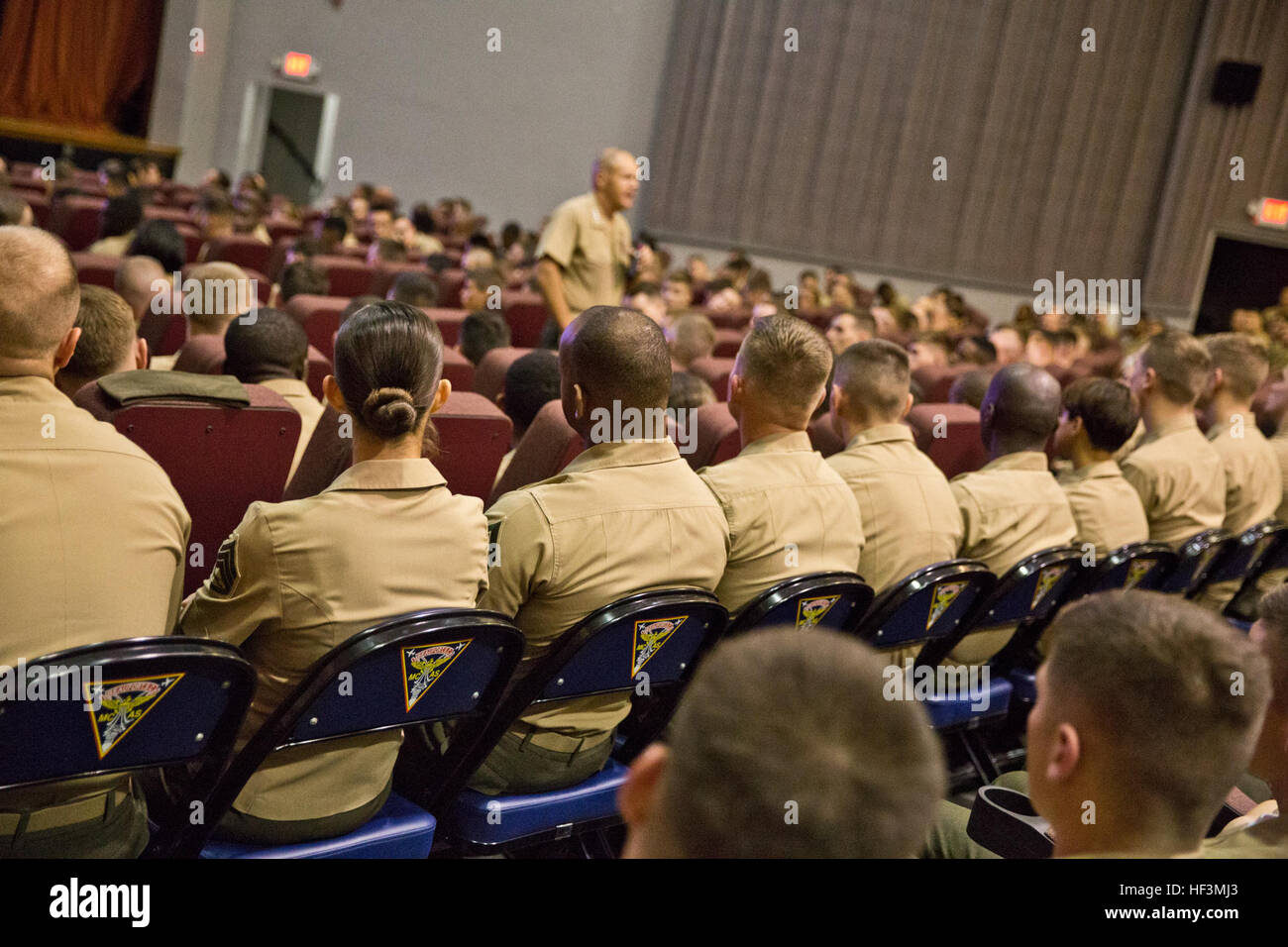 U.S. Marines listen to Commandant of the Marine Corps Gen. Robert B. Neller speak at Marine Corps Air Station Beaufort, S.C., Oct. 16, 2015. Neller outlined the Corps' current priorities and expectations, and listened to and answered questions during his visit. (U.S. Marine Corps photo by Sgt. Gabriela Garcia/Released) CMC Visits MCRD Parris Island and MCAS Beaufort 151016-M-SA716-285 Stock Photo