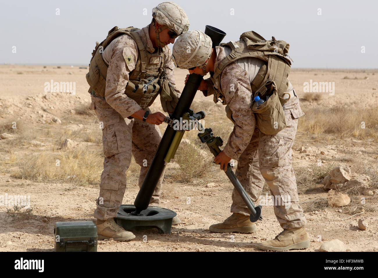 U.S. Marines with Weapons Company, 1st Battalion, 7th Marine Regiment, Special Purpose Marine Air-Ground Task Force--Crisis Response--Central Command, assemble a new M252A2 81mm mortar system during a live-fire training mission at Al Asad Air Base, Iraq, Oct. 24, 2015. The training allowed the Marines to build their proficiency with the new weapons system.  This unit is supporting the Combined Joint Task Force – Operation Inherent Resolve, which is a coalition of regional and international nations who have joined together to defeat the Islamic State of Iraq and the Levant and the threat they p Stock Photo