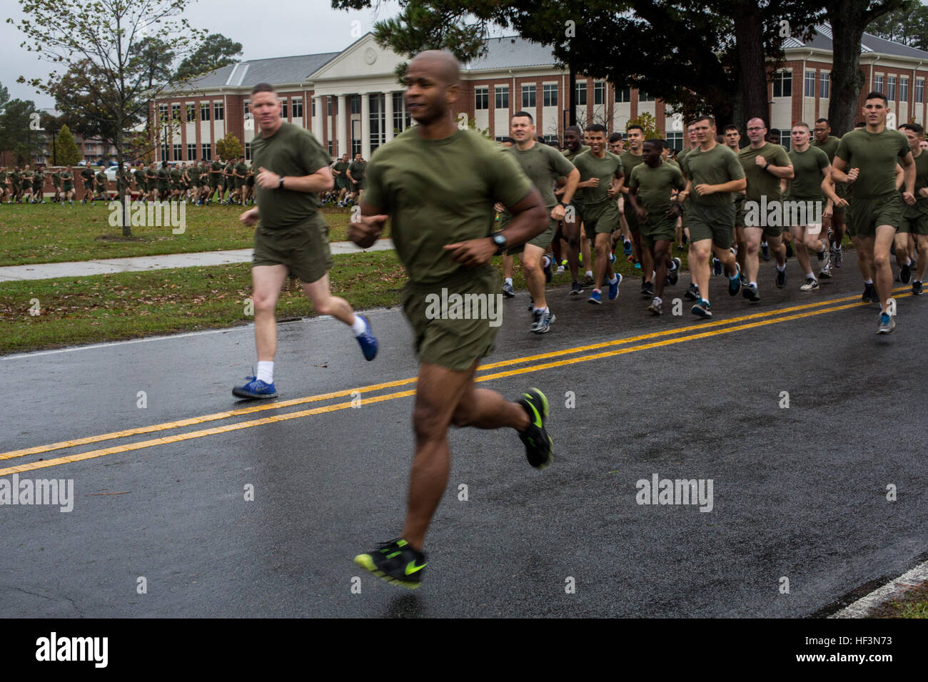 U.S. Marines and Sailors assigned to 2nd Marine Aircraft Wing participate in a formation run on Marine Corps Air Station Cherry Point, N.C., Nov. 9, 2015. The run was conducted in celebration of the Marine Corps' 240th Birthday. (U.S. Marine Corps photo by Lance Cpl. Jered T. Stone/Released) 2d MAW Birthday Run 151109-M-WP334-059 Stock Photo
